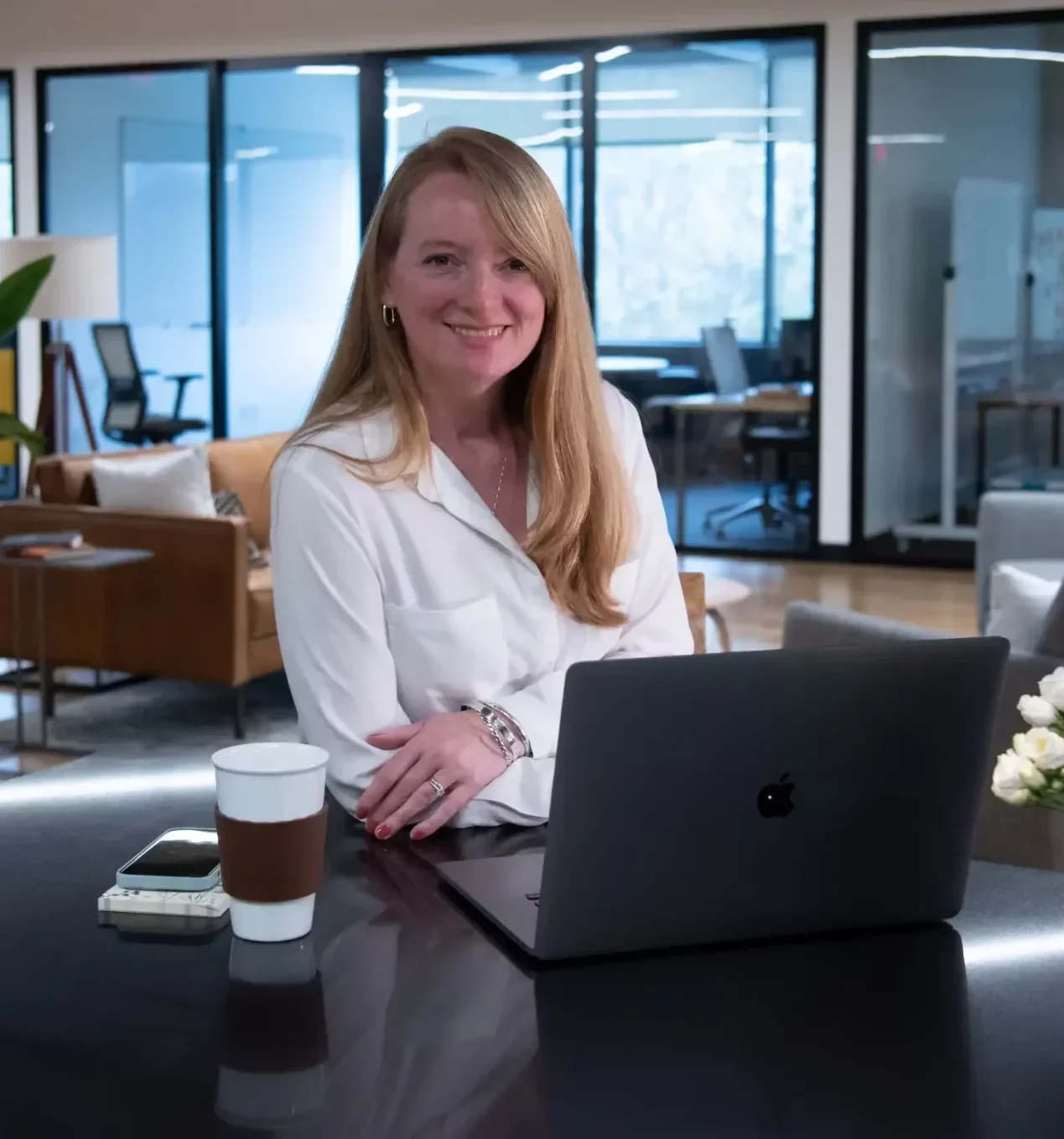 lady smiling at desk