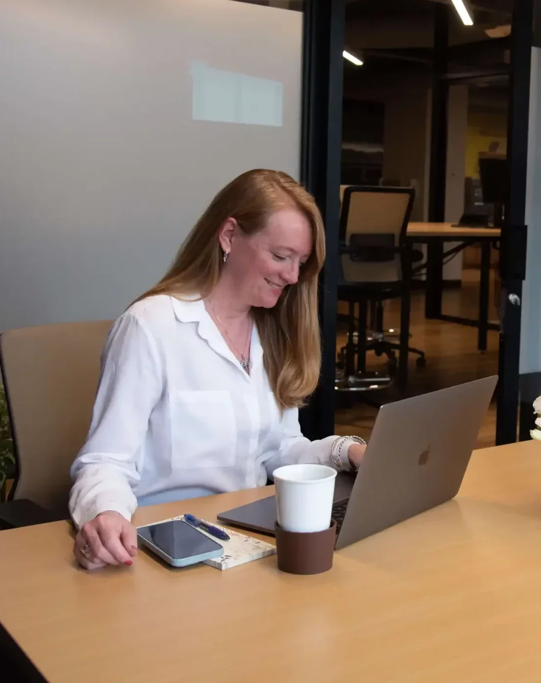 lady looking at laptop and smiling